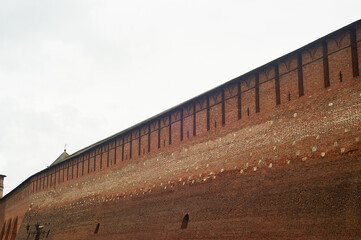 The ancient brick wall of the red brick fortress. Above the moat.Knight's times.