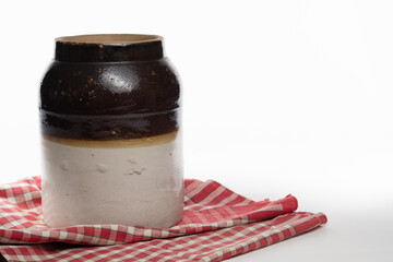 Antique apple butter crock isolated on a white background