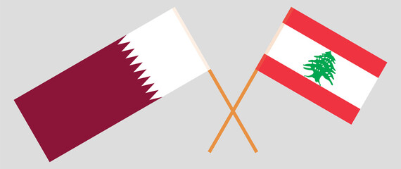 Crossed flags of Lebanon and Qatar