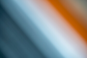 Blurred background in gray, blue and orange colors. Diagonal design