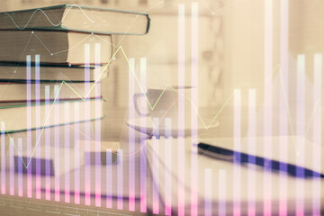 Double exposure of financial chart drawing and desktop with coffee and items on table background. Concept of forex market trading