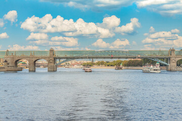 View of the Andreyevsky pedestrian bridge and the Moscow river in the summer, urban Moscow cityscape