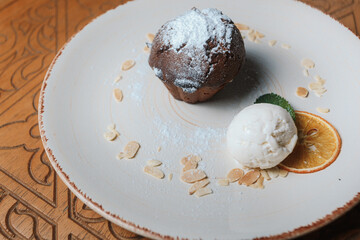 ice cream with chocolate sauce and fondant dessert