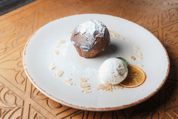 ice cream with chocolate sauce and fondant dessert