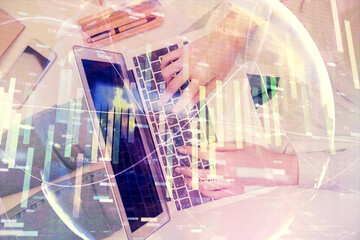 Double exposure of woman hands working on computer and financial theme hologram drawing. Top View. Business concept.