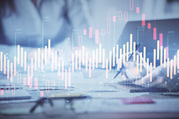 Multi exposure of woman hands typing on computer and financial chart hologram drawing. Stock market analysis concept.