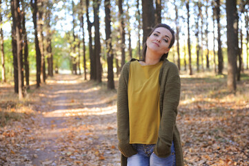 Young woman portrai in autumn park