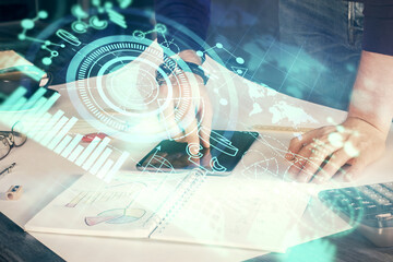 Double exposure of man's hands holding and using a phone and international business theme drawing.