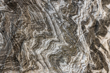 Abstract gray texture of natural, raw salt in an underground salt mine