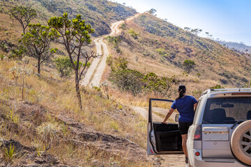 Girl driving on "Serra Calcada" at Serra da Canastra National Park © Luciano Queiroz