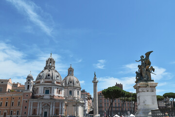Fototapeta na wymiar Rome panorama: domes and statues with partly cloudy sky.