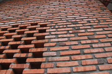 wall texture with red brick and cement arrangement. brick wall patterns for background and design...
