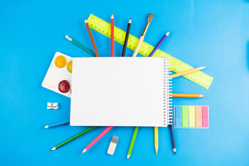 School supplies on a blue background.