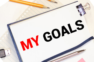 My Goals as memo on notebook with many light bulbs