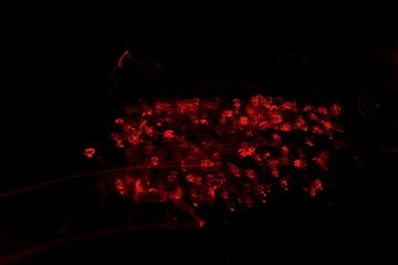 red embers fluttering and crackling in the dark.