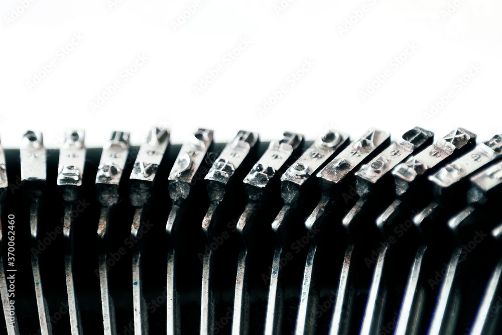 Fototapete the iron hammers with the letters imprinted inside an old typewriter. mechanical tools for writing. 