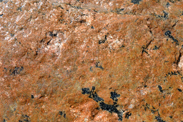 Red granite background.