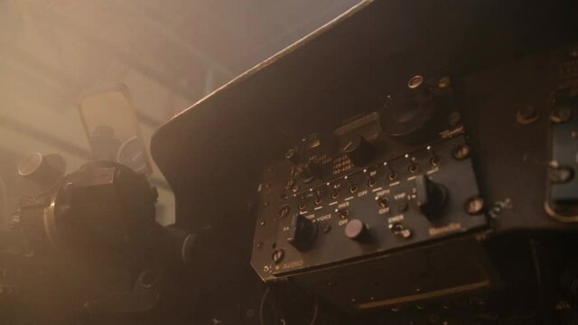 Interior of an Old Airplane Cockpit at Sunset.