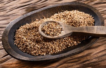 Anise seeds seasoning in a wooden bowl - Pimpinella anisum