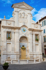 Fototapeta premium The 18th century baroque Fontana di Piazza Mercato (Market Square Fountain), with ancient clock, in the historic center of Spoleto