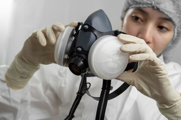 Nurse or doctor checking a mask respirator