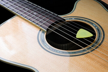 Obraz premium Acoustic guitar Natural wood color and music notepad