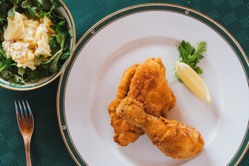 Viennese Fried Breaded Chicken wth Potatoe Mayonnaise Salad - A Tasty Classic Specialty o Austrian...