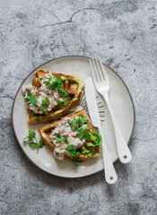 Healthy breakfast, brunch, snack, tapas - zucchini waffles with tuna, cream cheese pate  on a gray background, top view