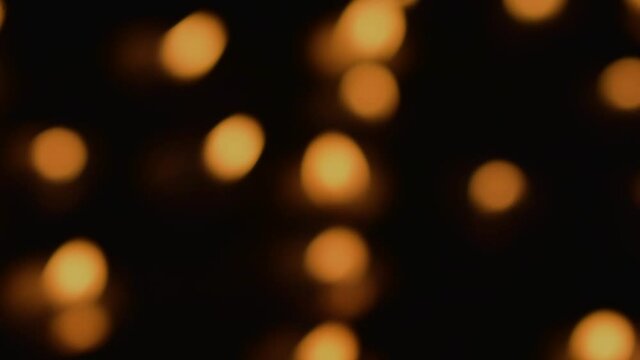Diya Lamp bokeh in dark blurry background at night. 