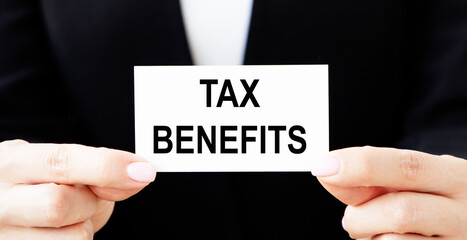 Goods and services and tax . GST inscription in business card on wooden background