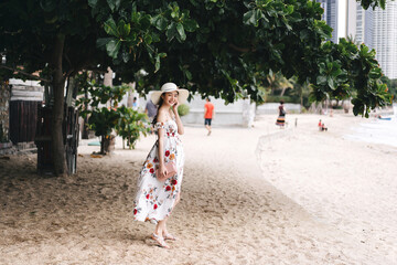 Portrait of young adult asian woman standing on the beach