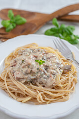Spaghetti pasta with mushrooms and creamy sauce