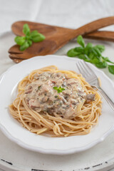 Spaghetti pasta with mushrooms and creamy sauce