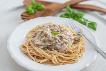 Spaghetti pasta with mushrooms and creamy sauce