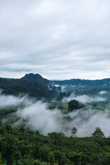 Landscape image of foggy greenery rainforest mountains and hills