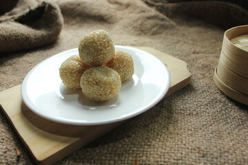 Onde-onde is made from fried flour or glutinous rice flour and the surface is coated with sesame seeds. Onde-onde is a popular street food in Indonesia