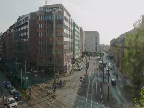 Time lapse of Frankfurt cityscape with people, buses and streetcars