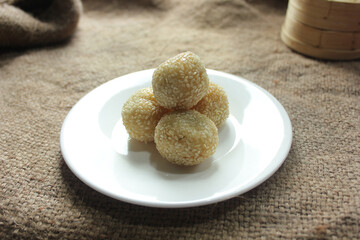 Onde-onde is made from fried flour or glutinous rice flour and the surface is coated with sesame seeds. Onde-onde is a popular street food in Indonesia