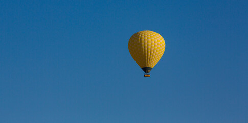 Hot air balloons profiled on clear blue sky, in Cappadocia, Turkey