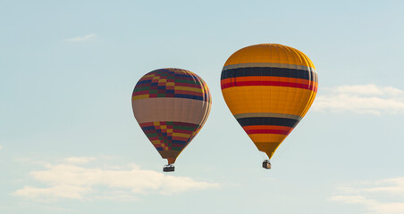 Hot air balloons profiled on clear blue sky, in Cappadocia, Turkey