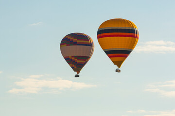 Hot air balloons profiled on clear blue sky, in Cappadocia, Turkey