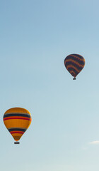 Fototapeta premium Hot air balloons profiled on clear blue sky, in Cappadocia, Turkey