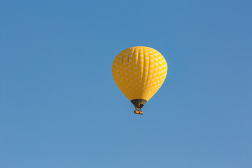 Hot air balloons profiled on clear blue sky, in Cappadocia, Turkey