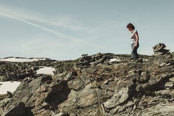 Tourist enjoying landscape norwegian nature