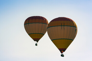 Hot air balloons profiled on clear blue sky, in Cappadocia, Turkey