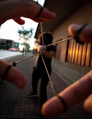 hands of a man with a needle