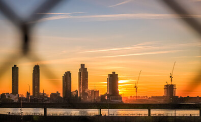 Fototapeta na wymiar Sunrise over the East River in New York City with Long Island City in the background