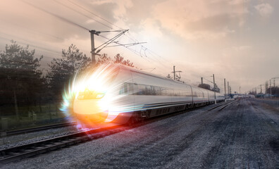 High speed train runs on rail tracks . Train in motion