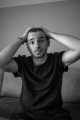Black and White, Emotional actor young man in a t-shirt posing on a green background