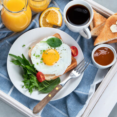 Traditional American breakfast on wooden tray